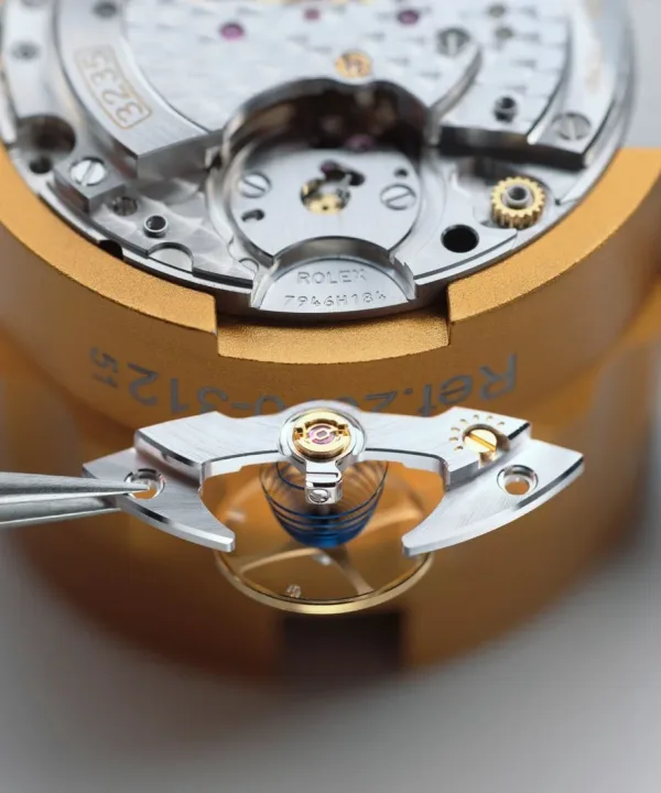 Rolex watch being serviced by a certified watchmaker at a service center