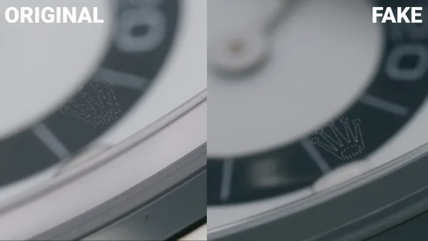 Rolex laser-etched crown at 6 oclock on sapphire crystal magnified view