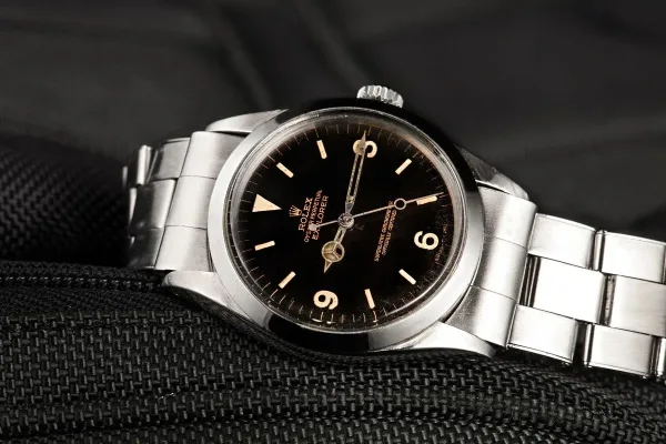Vintage Rolex Explorer black dial showing patina character on Oyster bracelet