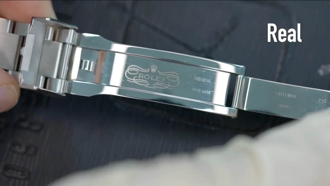 Genuine Submariner Glidelock clasp open view with perfect crown engraving and SWISS MADE markings